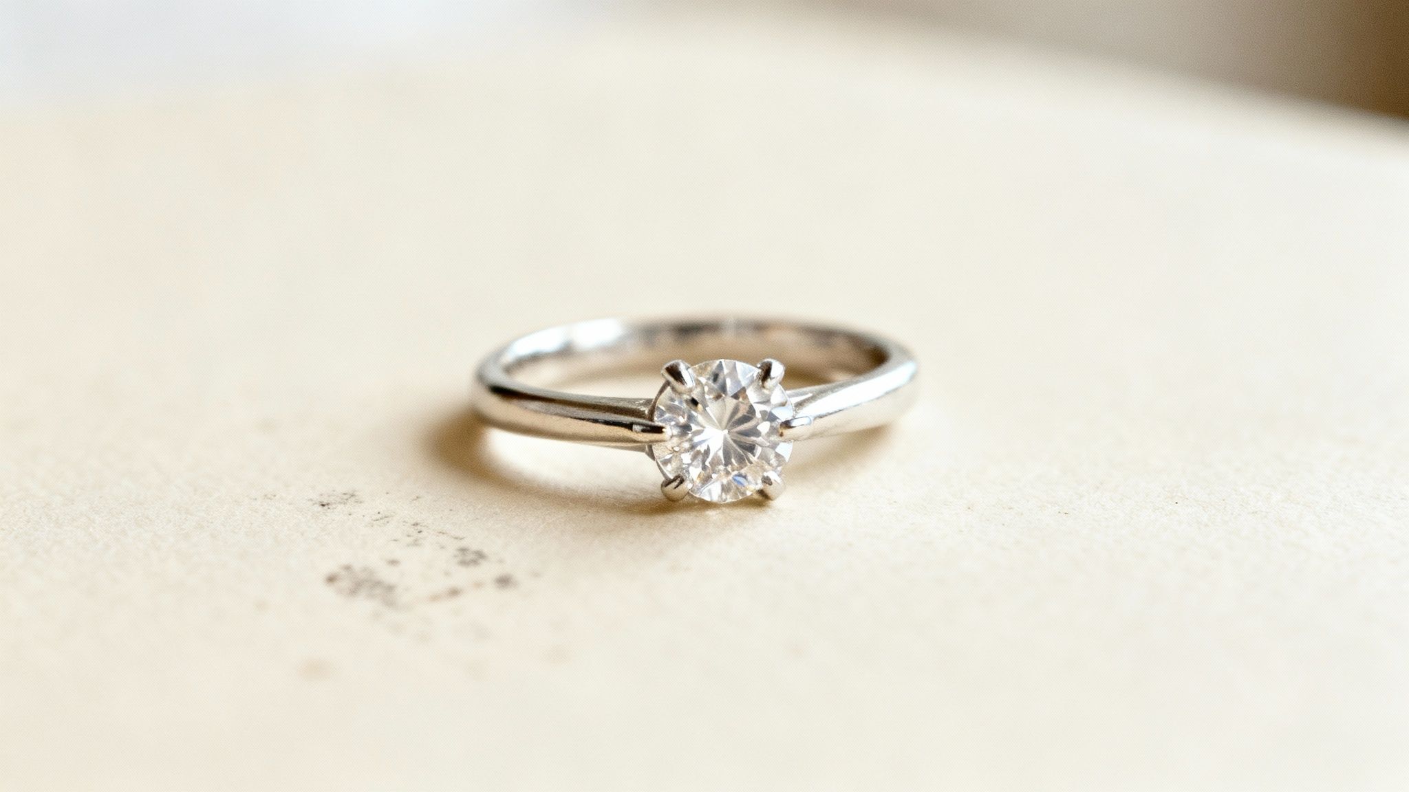 A close-up of a brilliant diamond ring sparkling under the light.