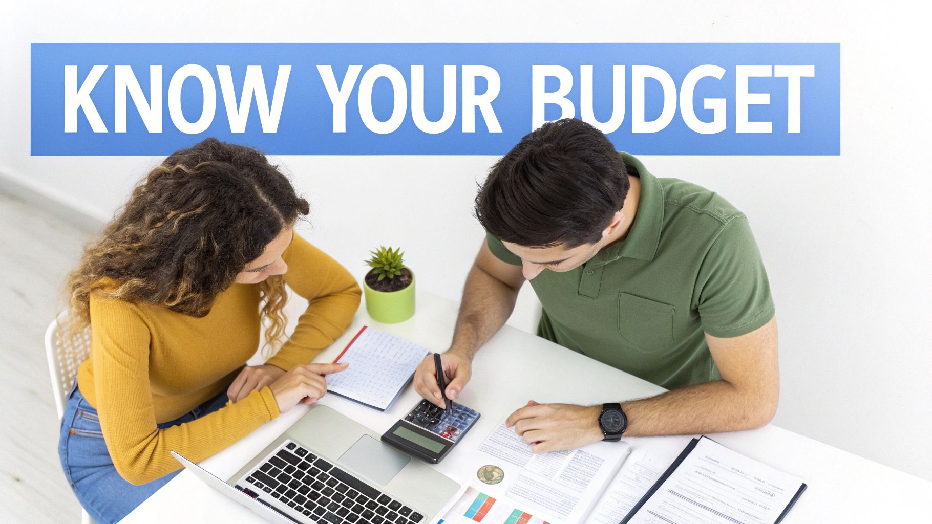 A couple discusses finances and budgeting at a desk under a 'Know Your Budget' sign.