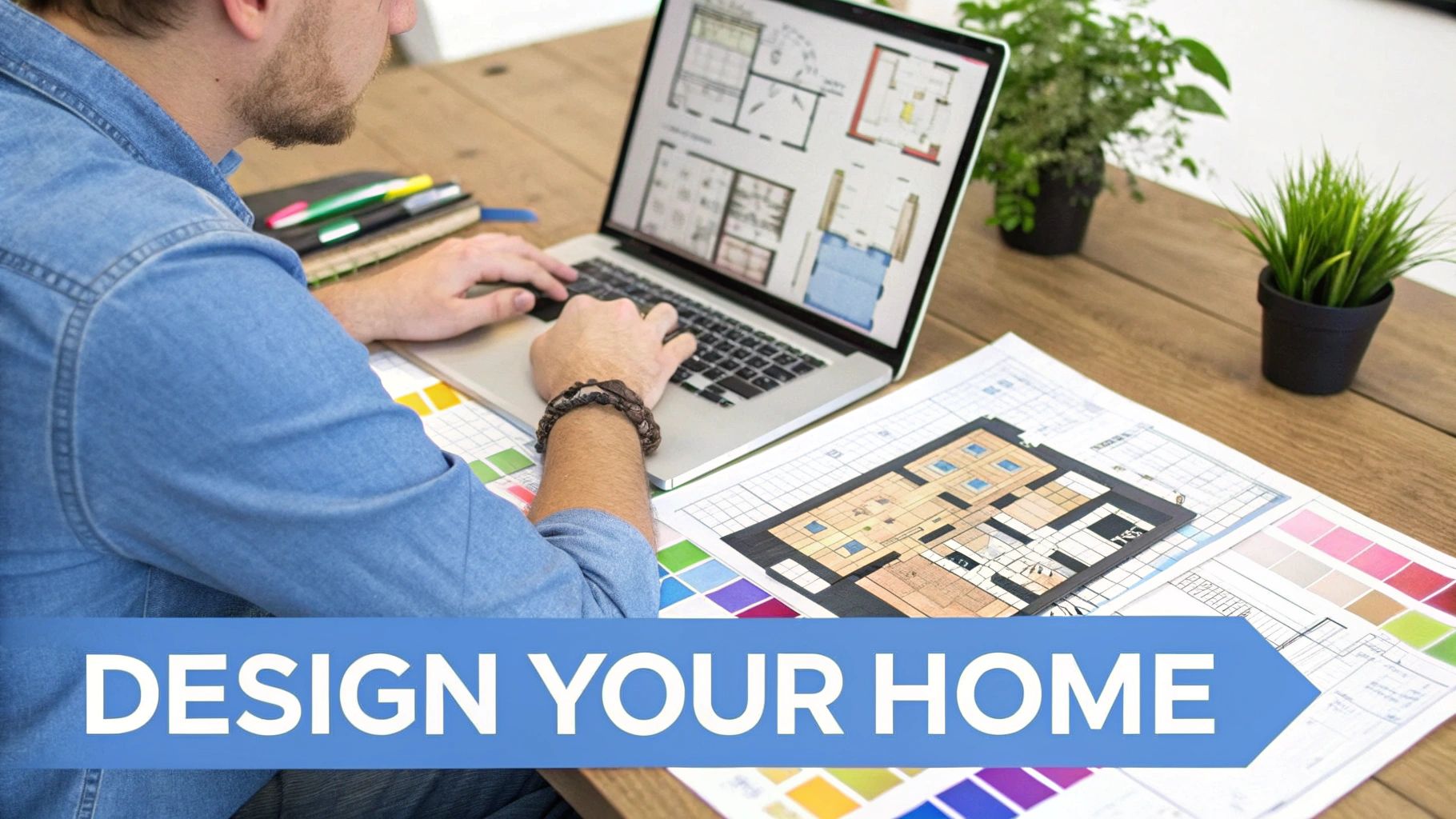 Interior designer working on floor plan layout on laptop with color swatches and blueprints