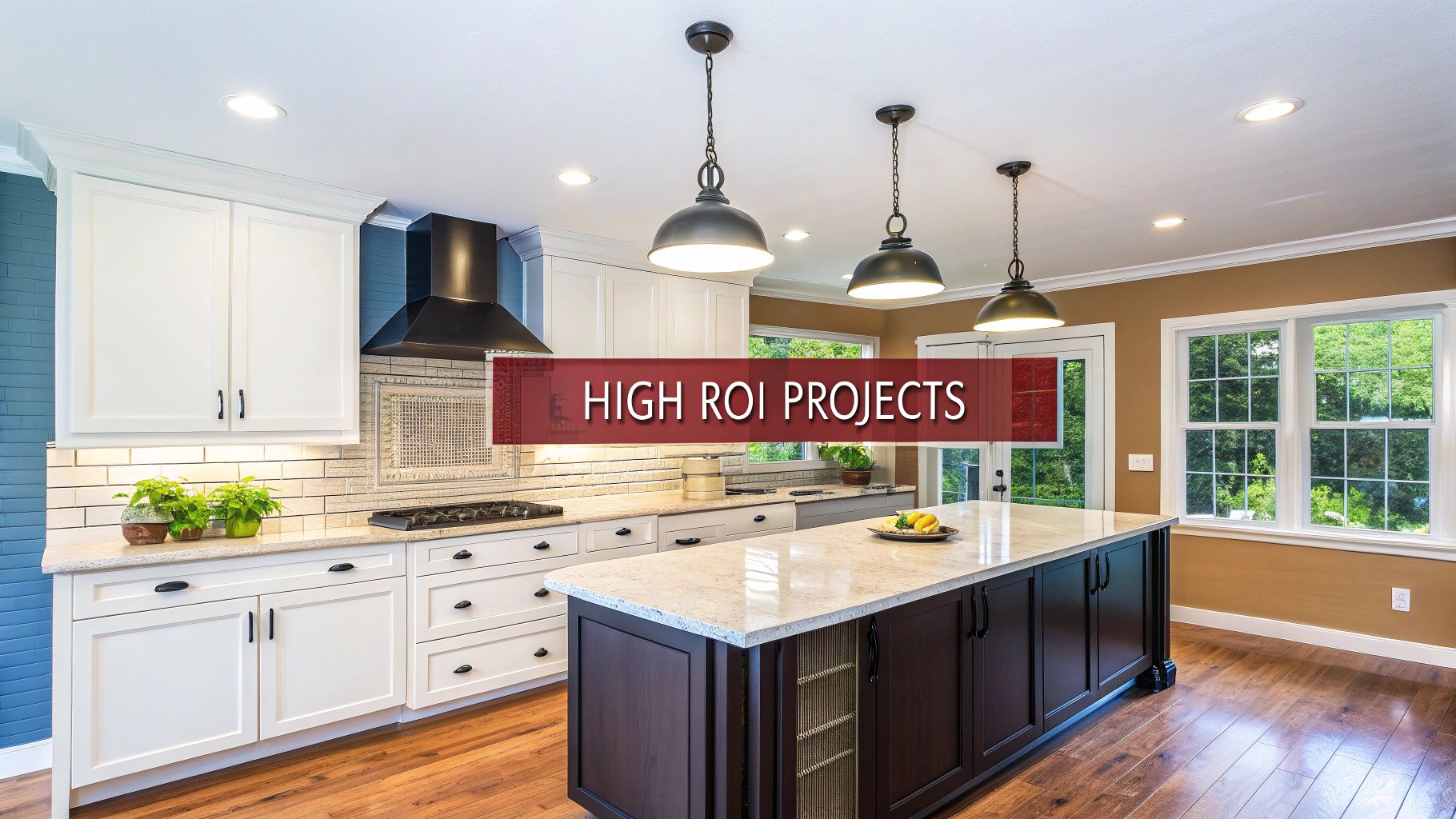 A newly renovated modern kitchen featuring white cabinets, a large dark island, and pendant lights.