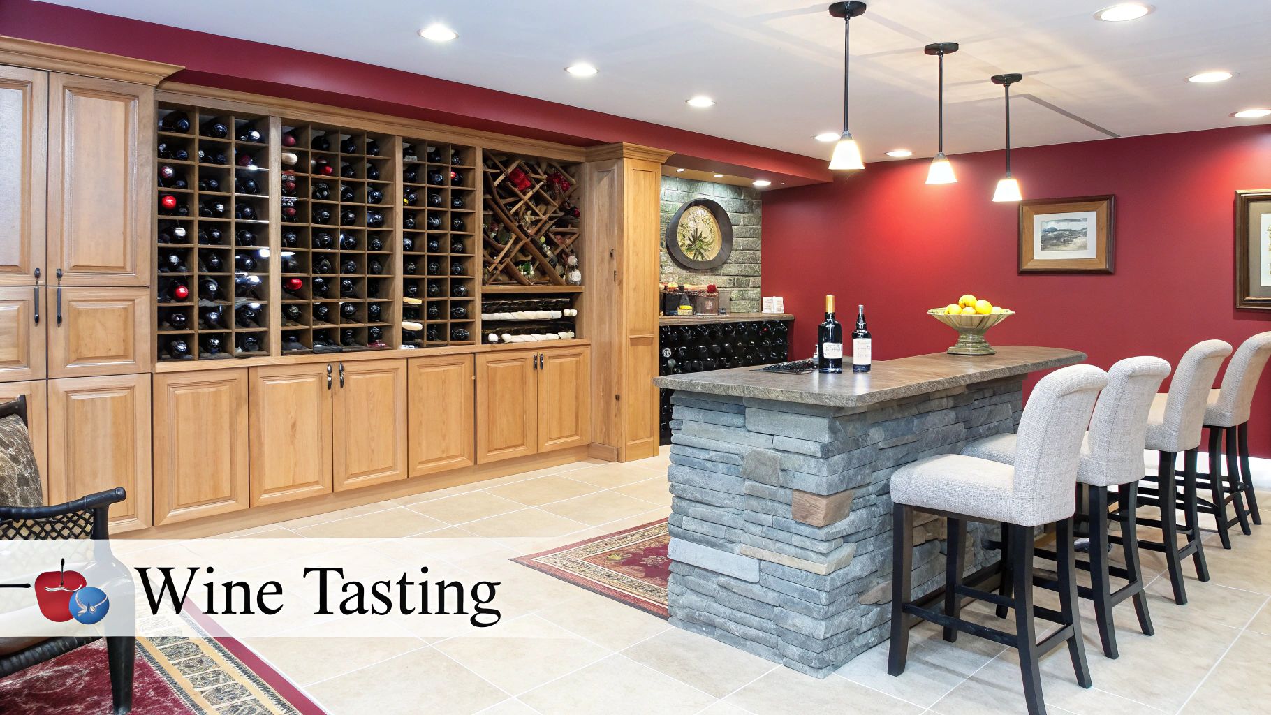 A sophisticated basement wine tasting room featuring extensive wood wine racks, a stone bar, and seating.