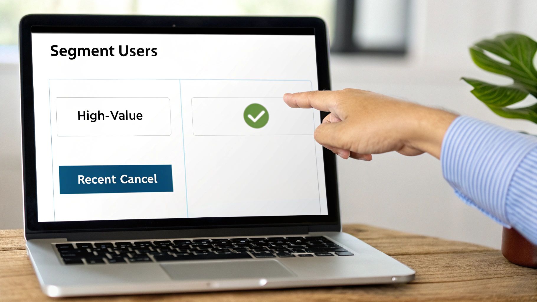 Person pointing at laptop screen showing user segmentation interface with high-value customers selected