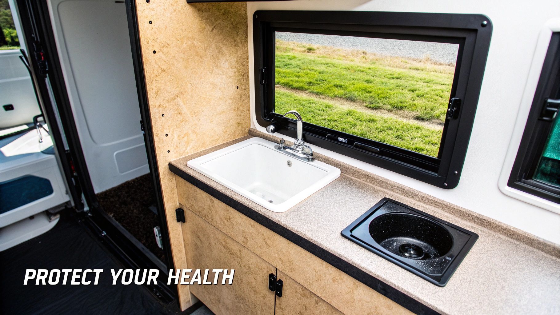 A person in an RV using the kitchen sink faucet