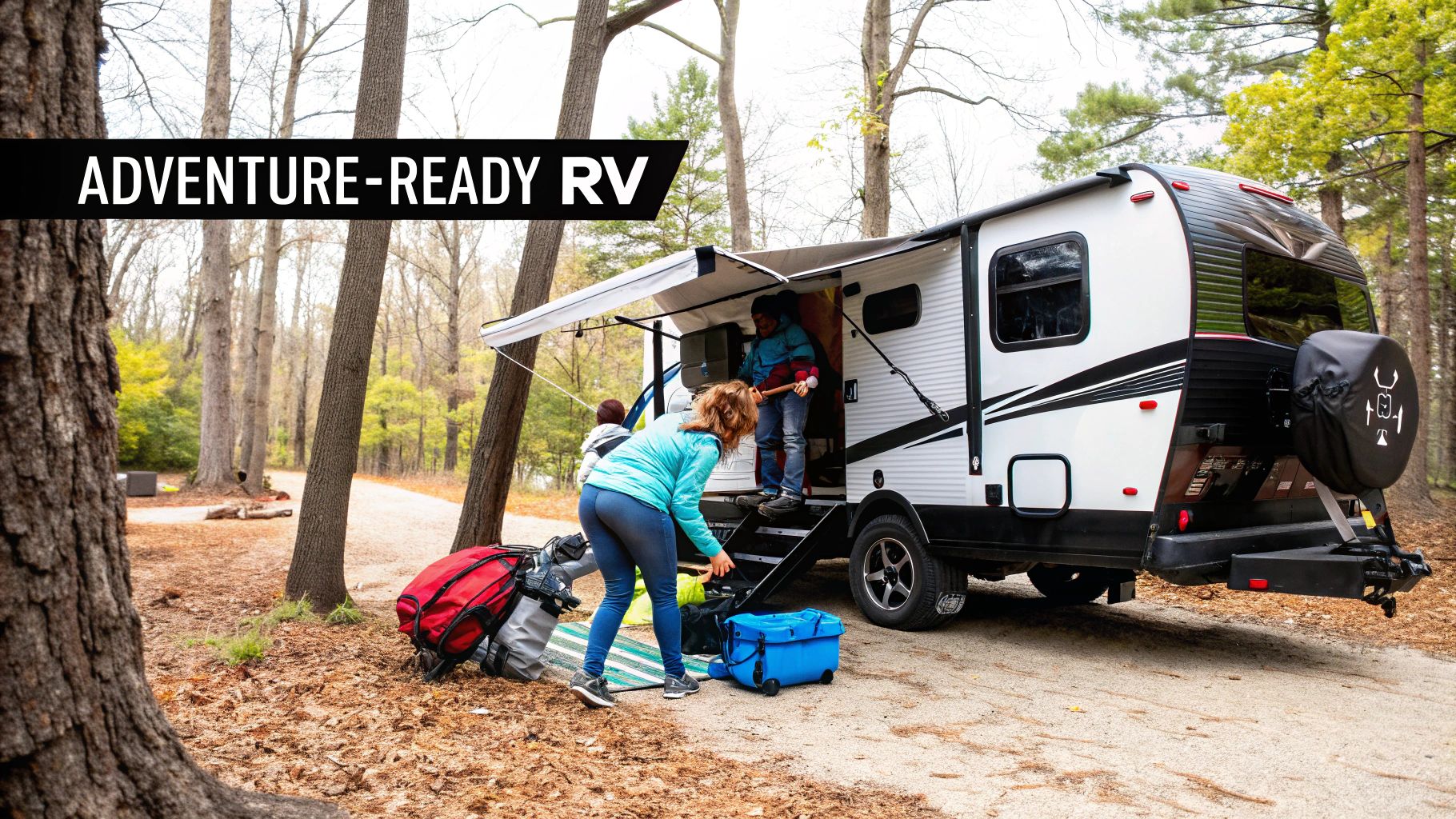 Family sitting together by their travel trailer in a scenic outdoor location