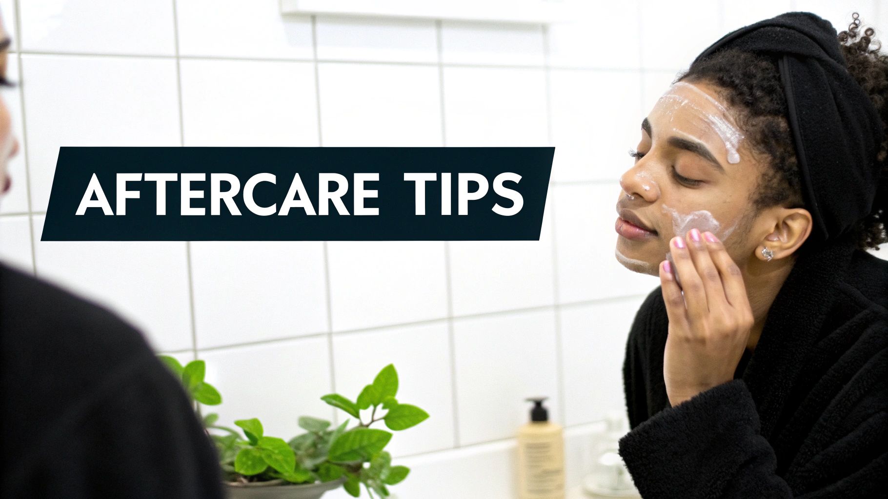 Woman applying skincare product to her face in a clean, bright bathroom
