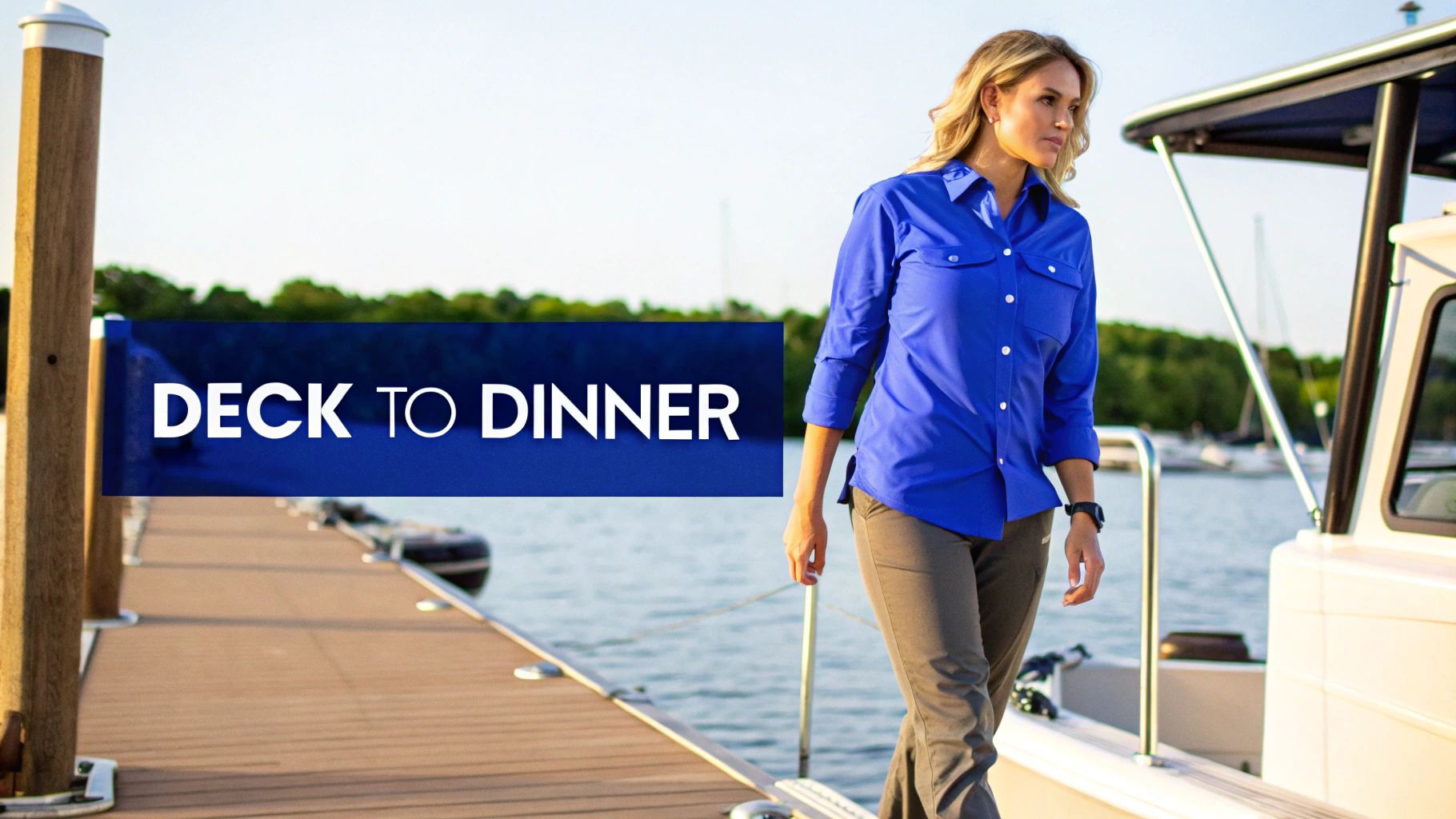 Woman in a blue fishing shirt and grey pants walks on a dock, illustrating 'Deck to Dinner' style.