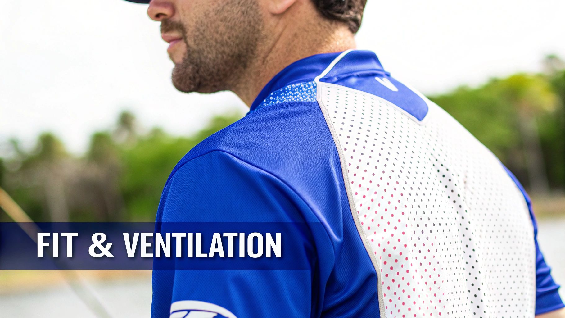Man in a blue and white perforated fishing shirt, showcasing features for fit and ventilation.