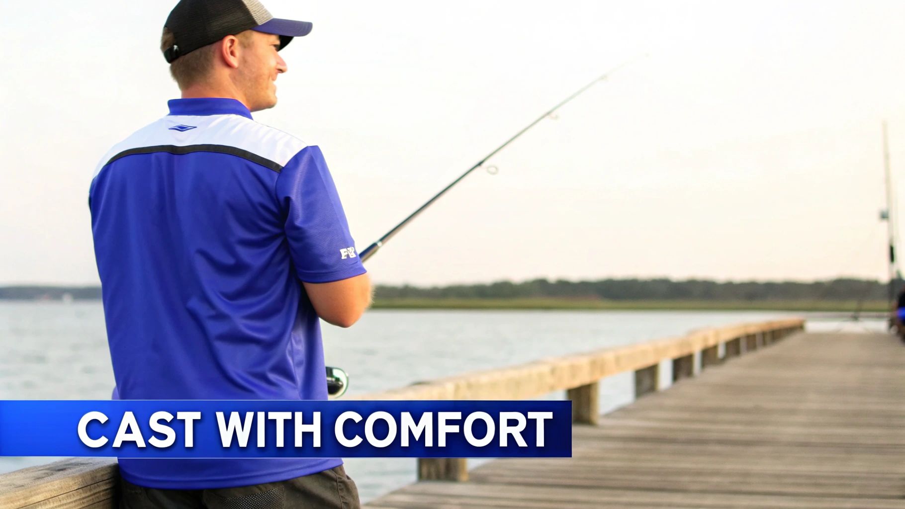 An angler in a relaxed-fit fishing tee shirt casting a line with ease.
