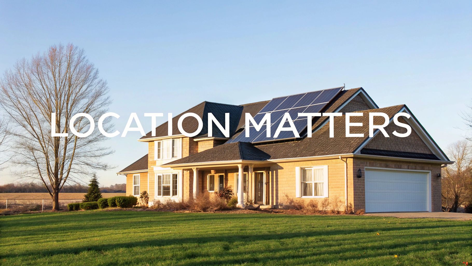 A modern home with solar panels installed on its roof, surrounded by green trees under a clear blue sky.