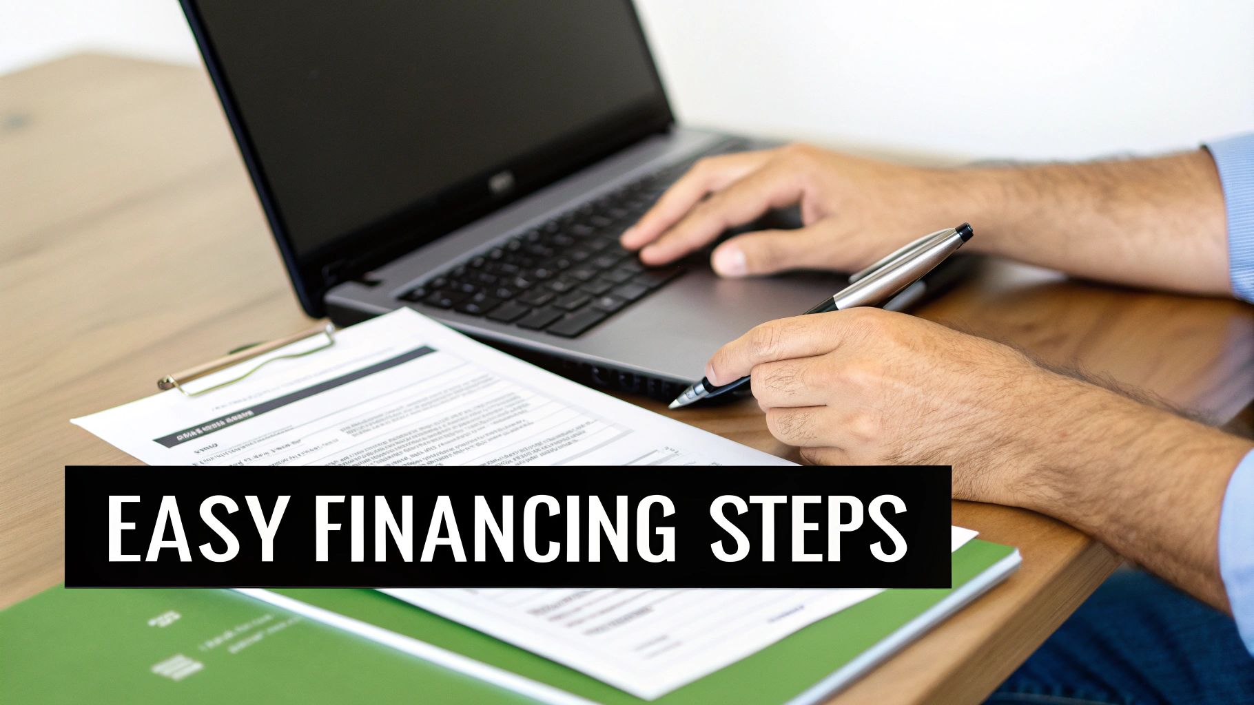 Hands of a person typing on a laptop and holding a pen over documents, with 'EASY FINANCING STEPS' text.