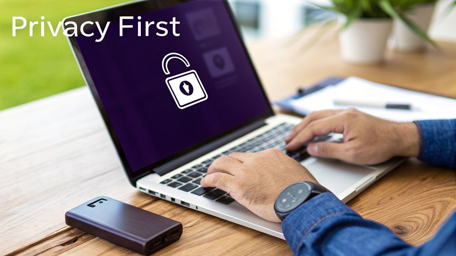 A person typing on a laptop displaying 'Privacy First' and an unlocked padlock icon.