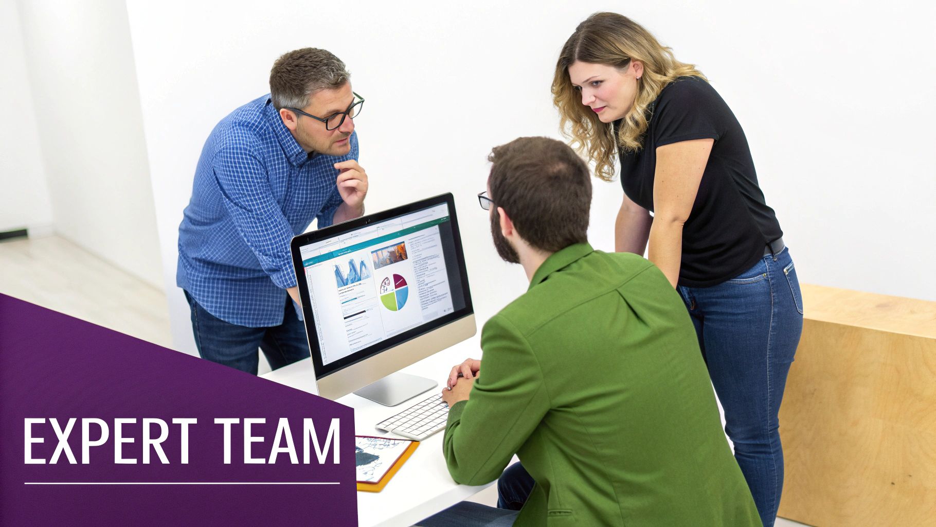 Three professionals, two men and one woman, collaborating around a computer screen displaying various charts and data.