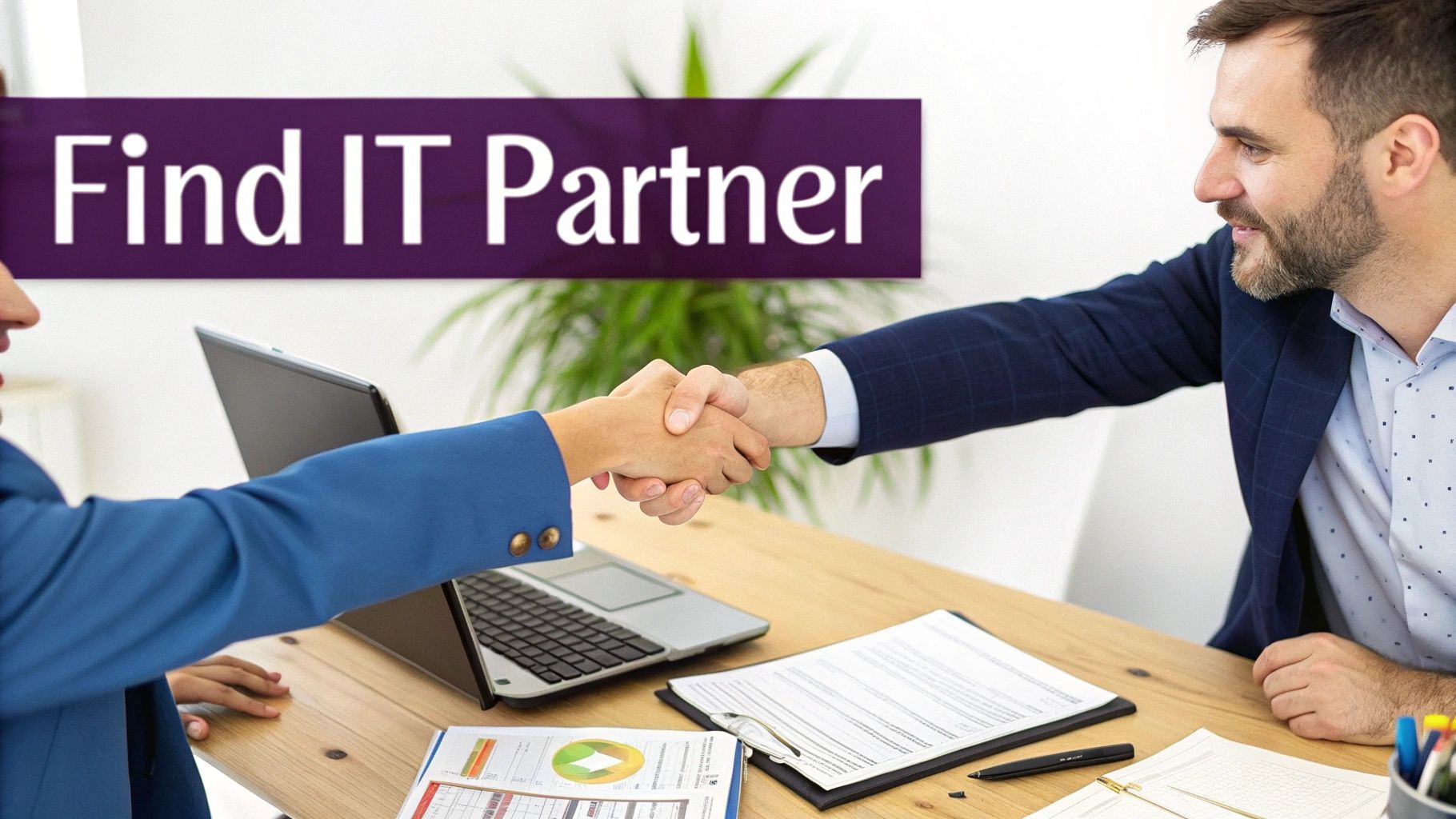 A business owner shaking hands with an IT professional across a desk.