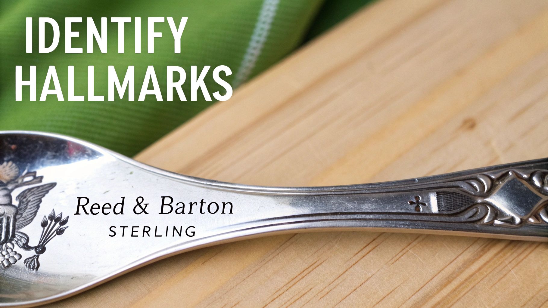 Close-up of a Reed & Barton sterling silver spoon, showing its hallmark and elegant design.