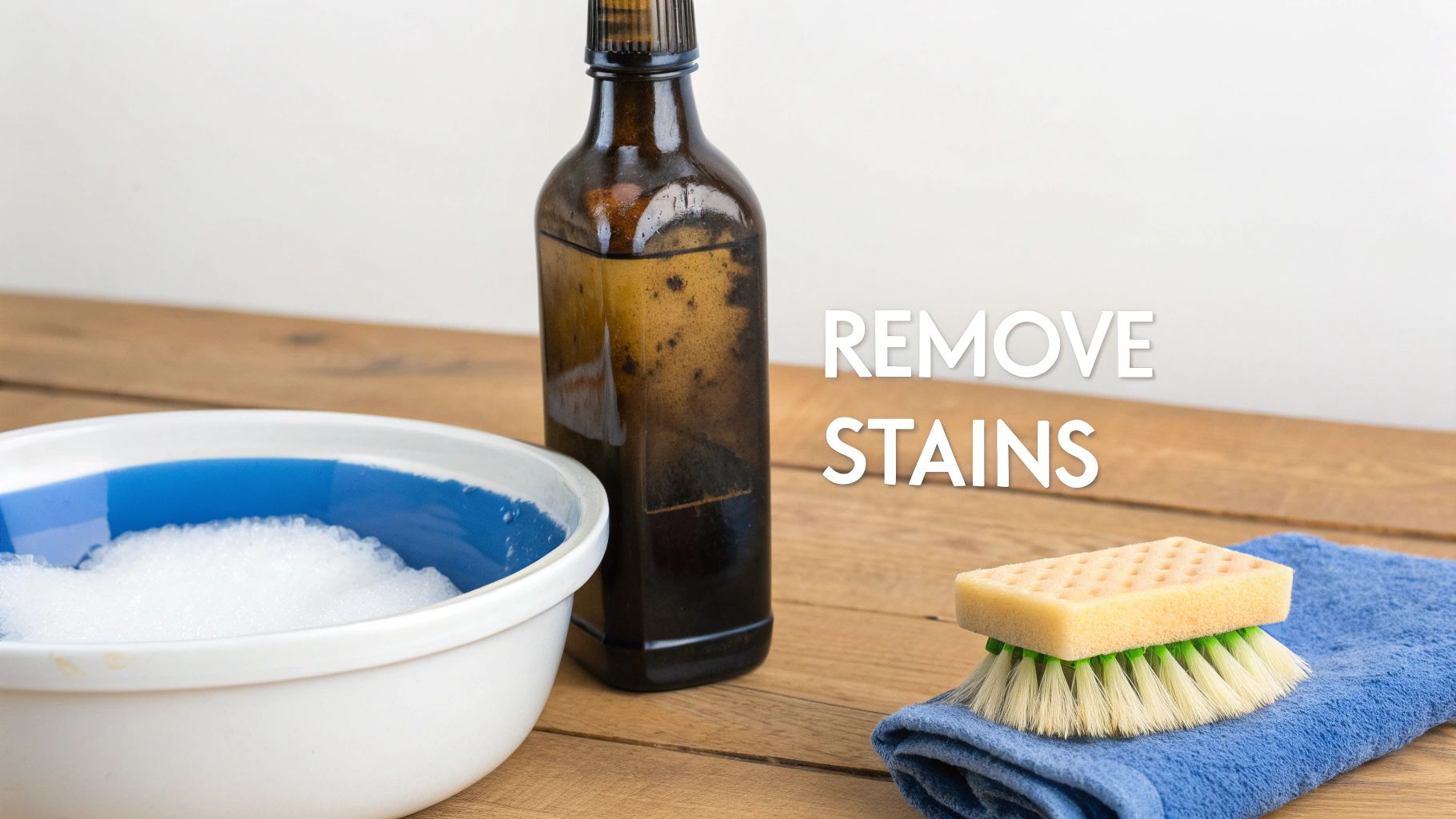 A cloudy antique bottle is held up against a window, showing the mineral deposits and stains inside.
