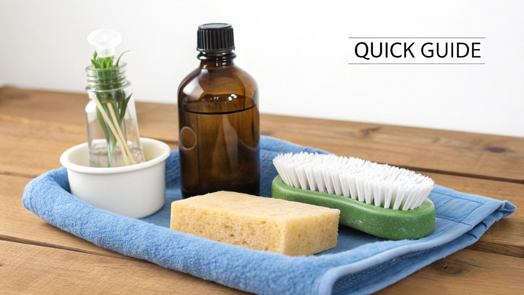 Close-up of a person carefully cleaning the inside of a dusty, antique glass bottle with a long, thin brush.