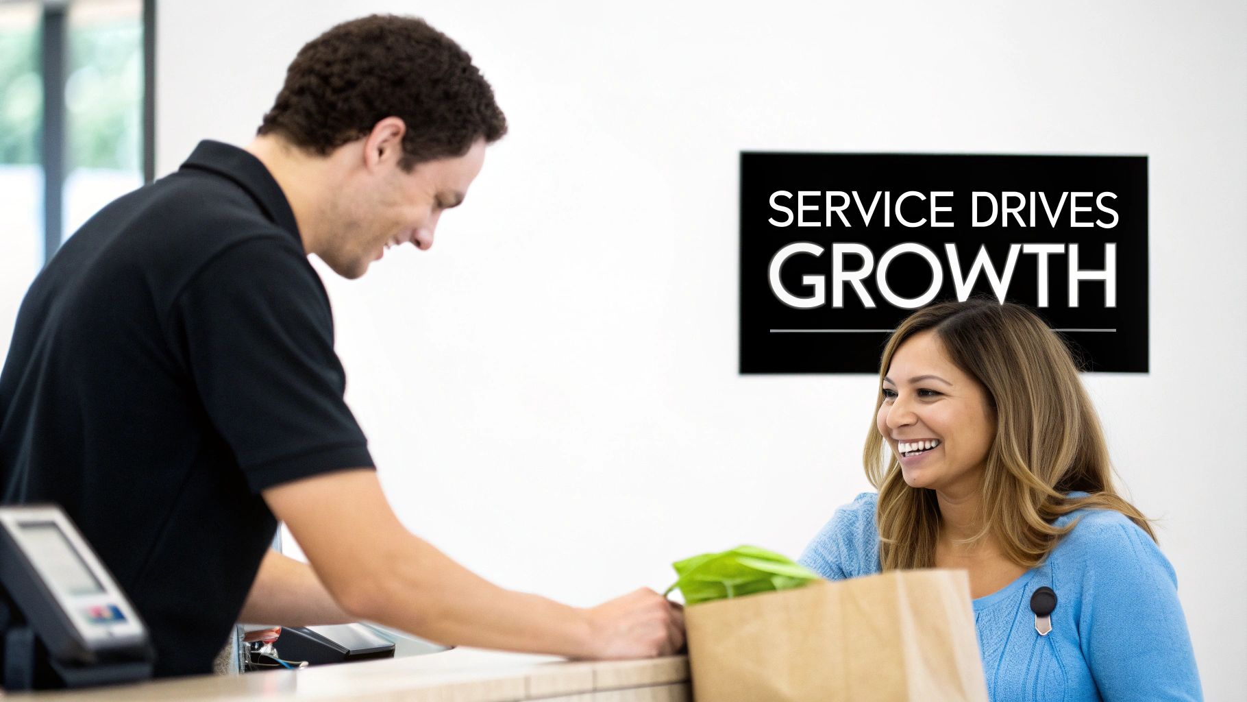 A smiling male employee serves a happy female customer at a retail counter, with a 'SERVICE DRIVES GROWTH' sign.