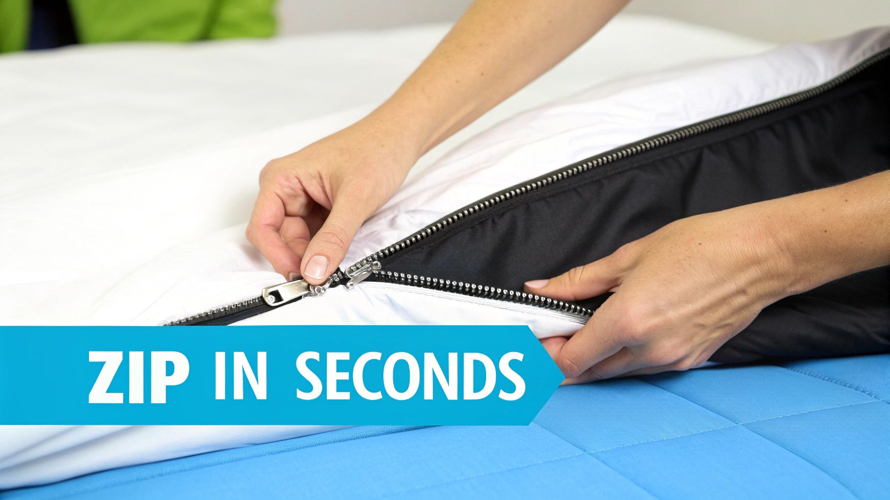A person's hands quickly zipping up a black and white bed cover on a blue mattress, indicating fast setup.