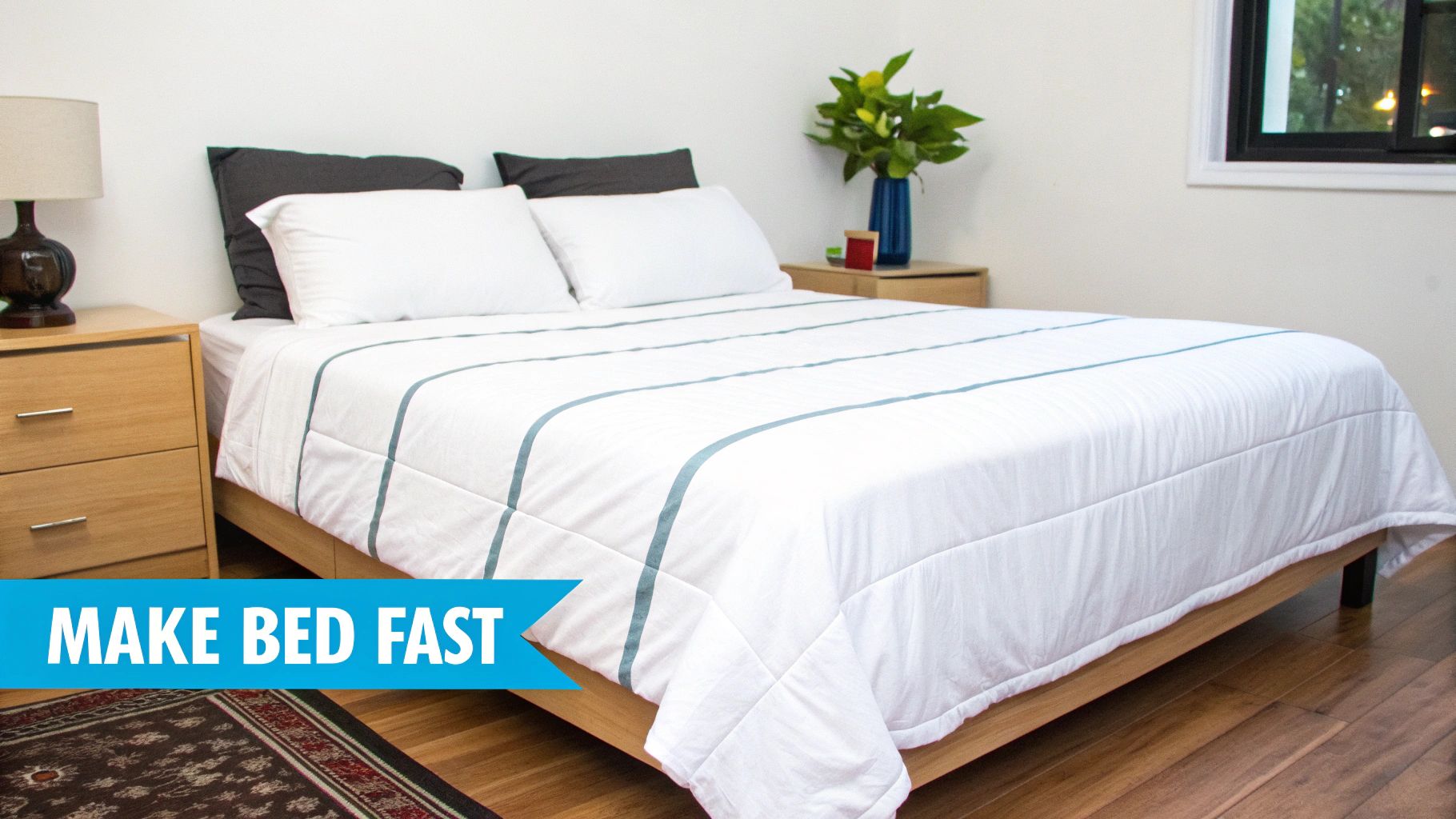 A neatly made bed with white and blue striped bedding in a clean bedroom setting.