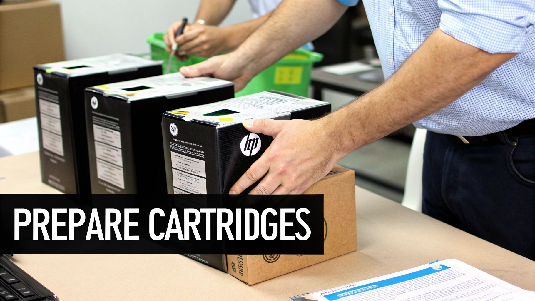 A person's hands are placing a black HP toner cartridge into a brown box on a table, with other cartridges nearby.
