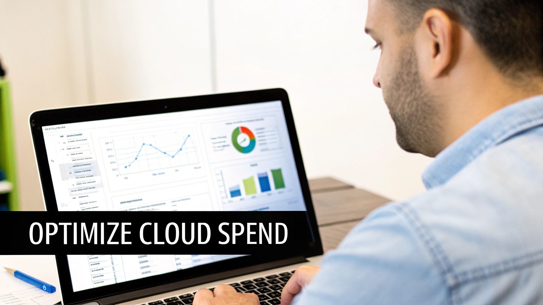 A man viewing cloud spend optimization dashboards with graphs and charts on a laptop screen.