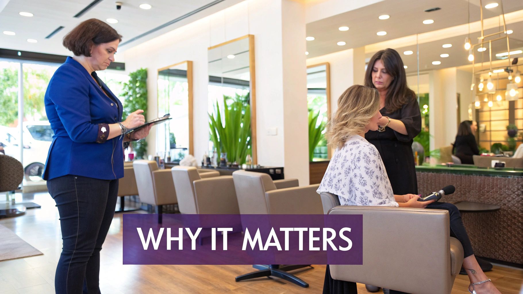 A stylist focused on cutting a client's hair in a modern salon setting.