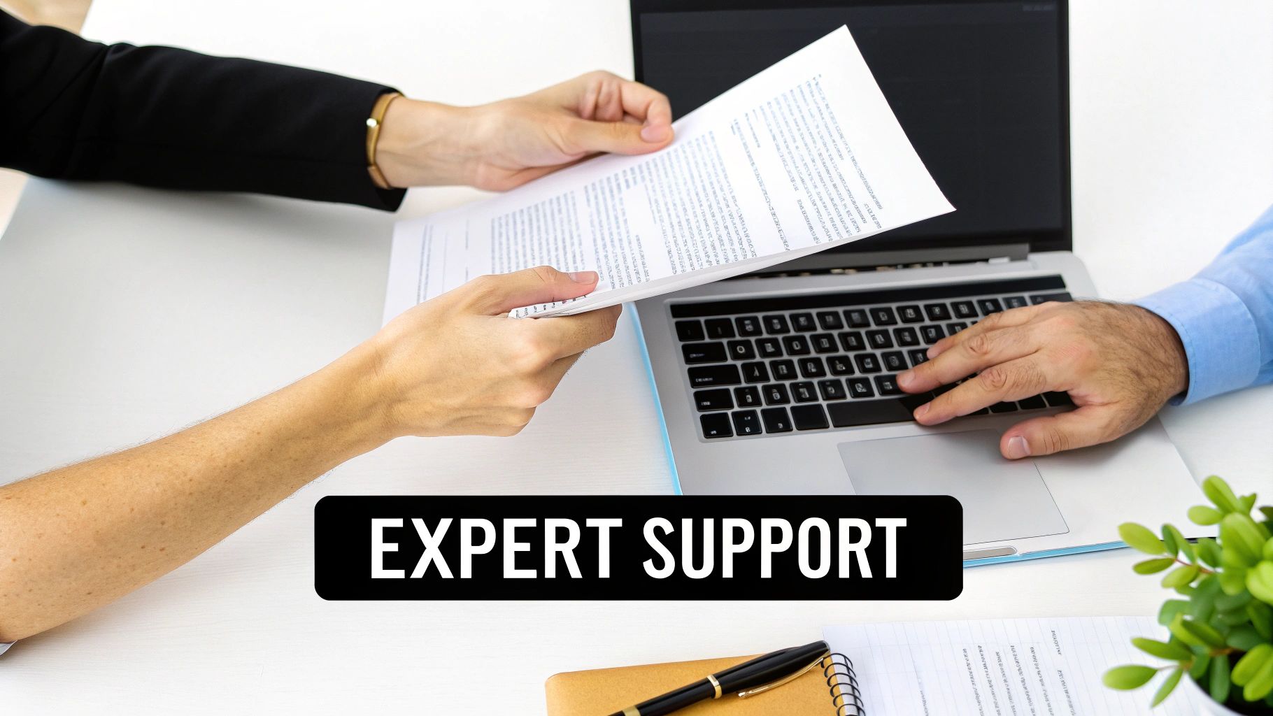 Two people reviewing documents and using a laptop at a desk, with a black banner displaying 'EXPERT SUPPORT'.