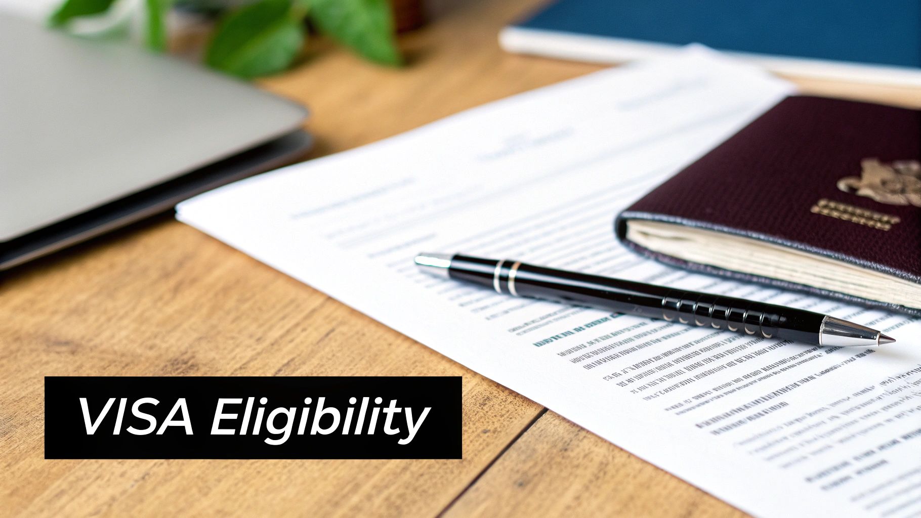 A desk with a passport, pen, application form, and a laptop, displaying 'VISA Eligibility'.