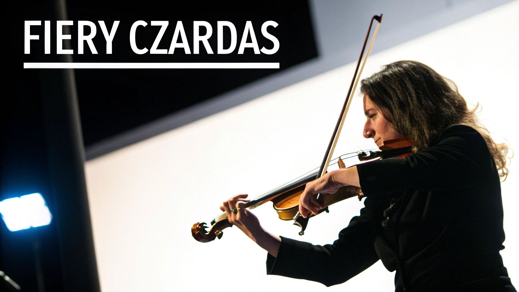 A woman passionately playing the violin on stage, with 'FIERY CZARDAS' text overlay.