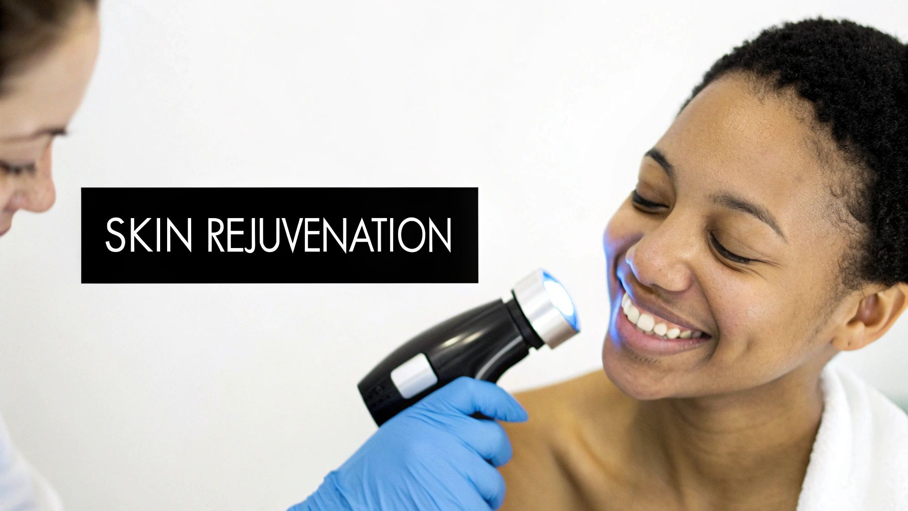 A smiling woman receives blue light skin rejuvenation therapy from a gloved professional.