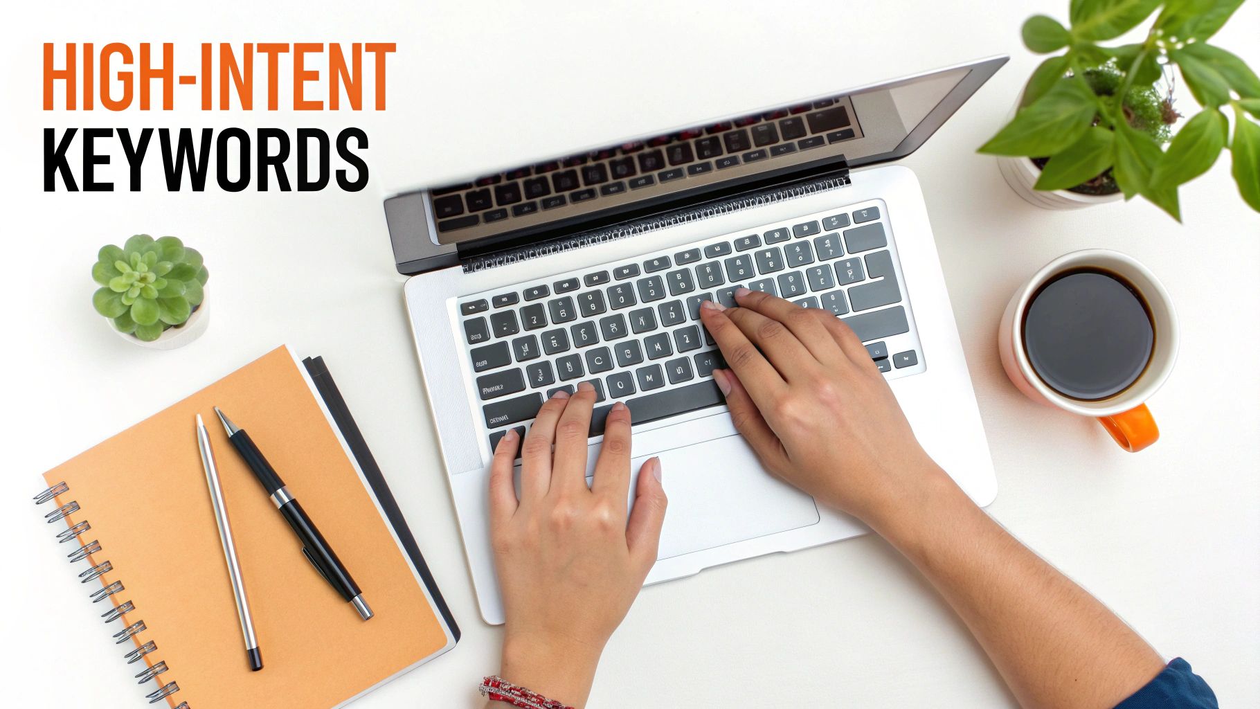 Hands typing on a laptop, next to coffee and plants, with 'High-Intent Keywords' title.
