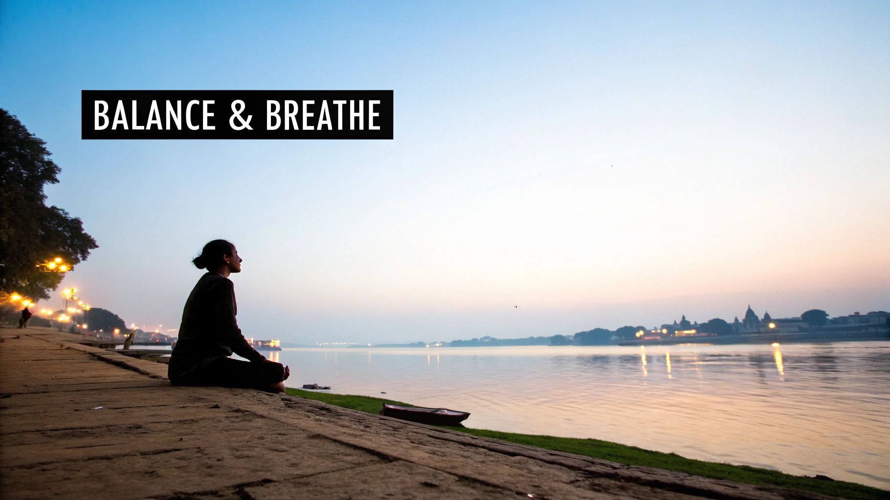 Your Ultimate Guide: adventure trip in rishikesh 2 A person meditating peacefully by the Ganges River in Rishikesh