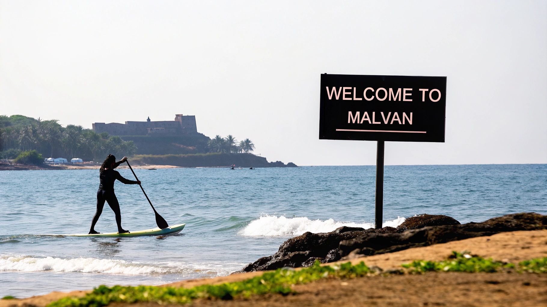 Your Guide to Malvan Water Sports Packages 1 People enjoying parasailing in the clear blue waters of Malvan with a historic fort in the background.