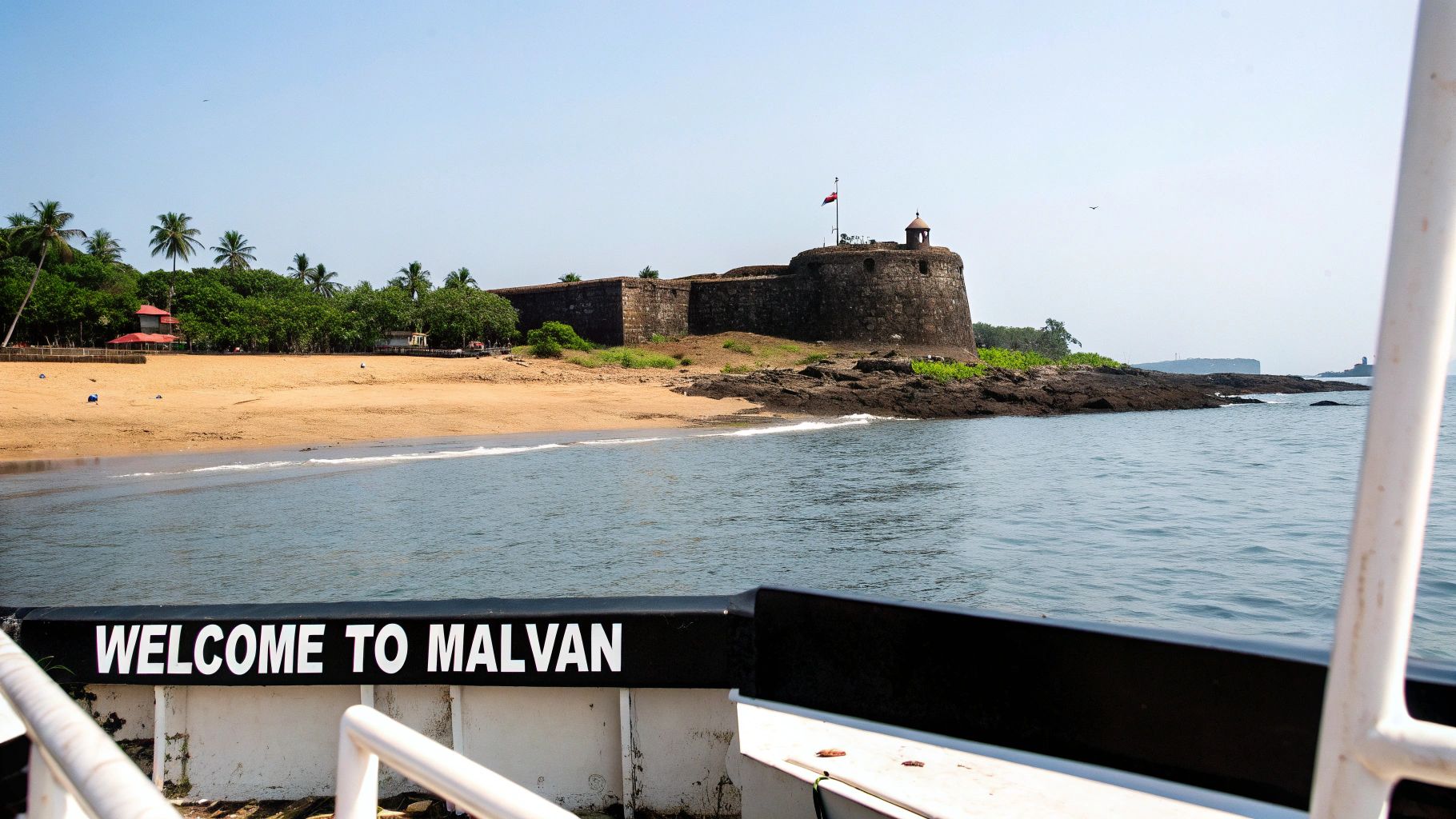 Your Ultimate Malvan Travel Guide 1 A serene view of Malvan's coastal beauty with traditional boats