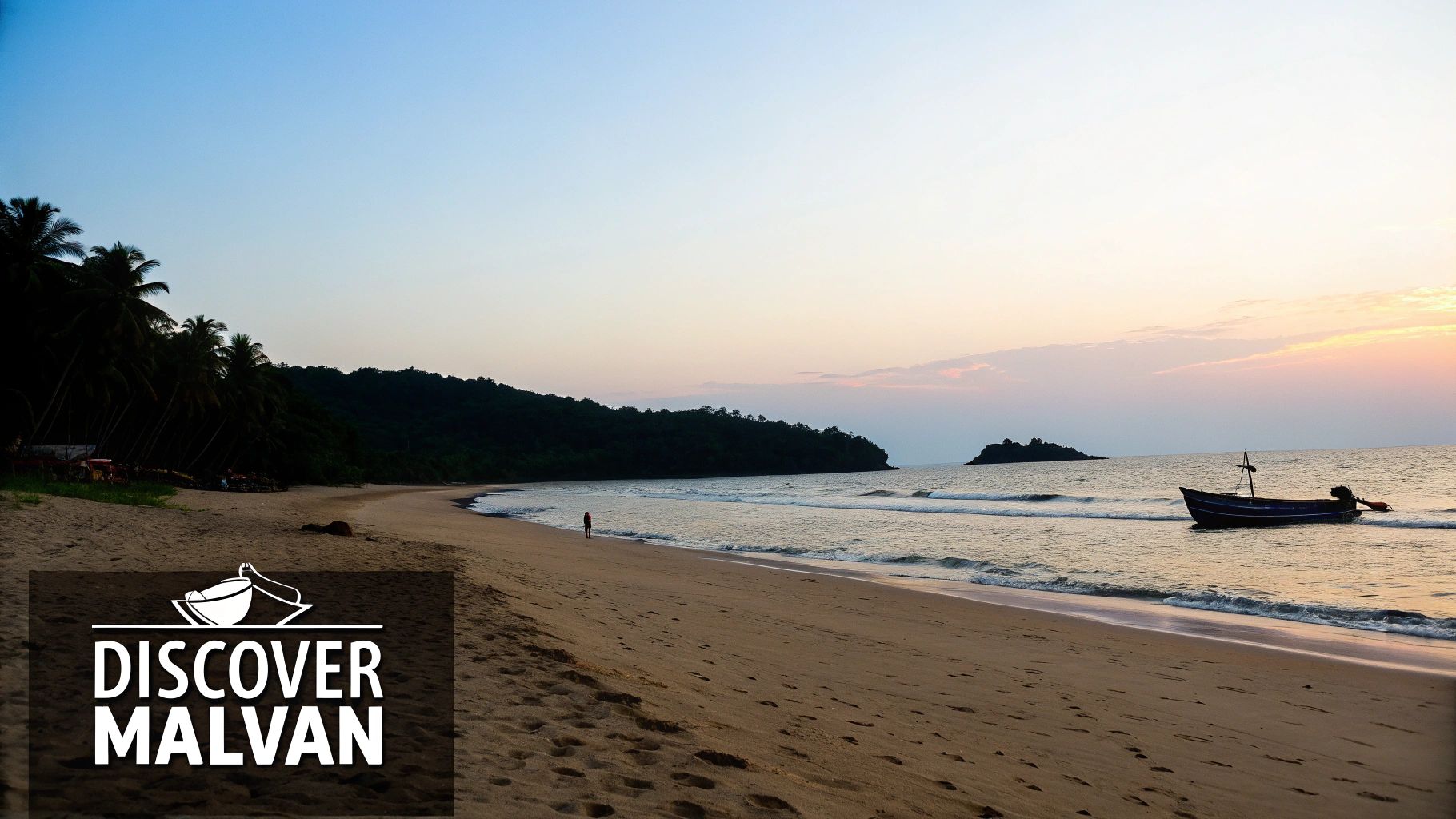 Your Complete Malvan Beach Travel Guide 1 A serene view of Malvan Beach with traditional fishing boats on the shore and the Sindhudurg Fort in the distance.