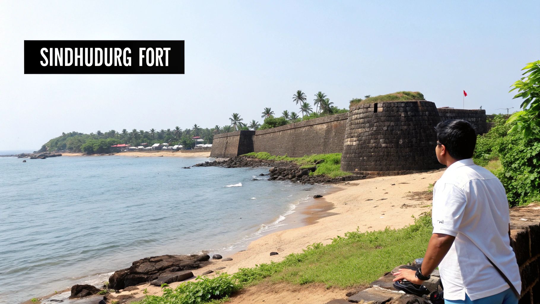 Your Complete Malvan Beach Travel Guide 3 View of the historic Sindhudurg Fort from Malvan Beach, with boats in the foreground.
