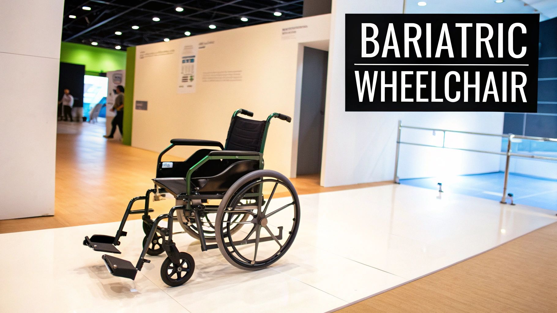 A bariatric wheelchair with green accents stands in a bright, modern hospital hallway.