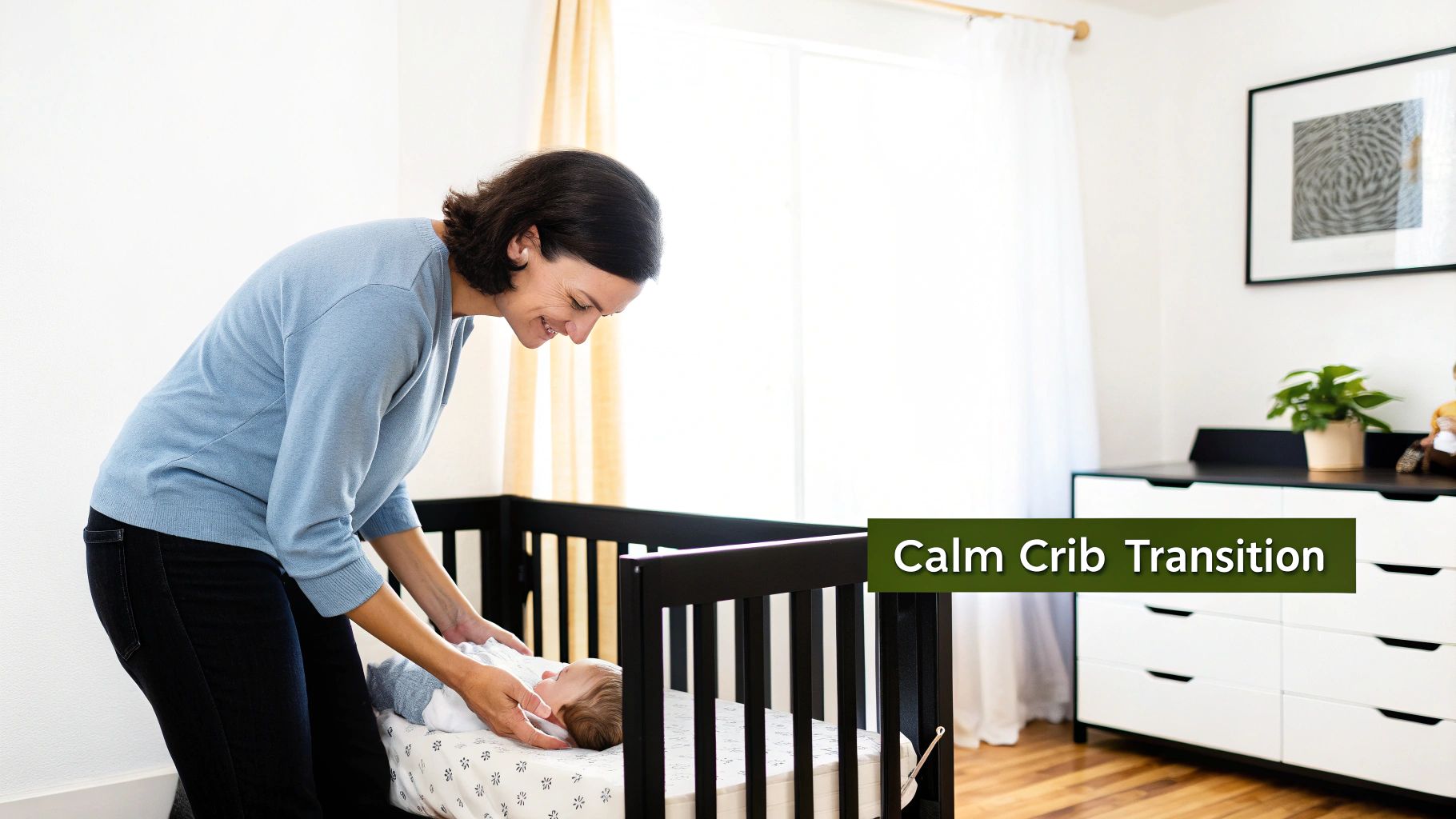 A smiling mother gently and calmly places her baby into a black crib in a bright nursery.