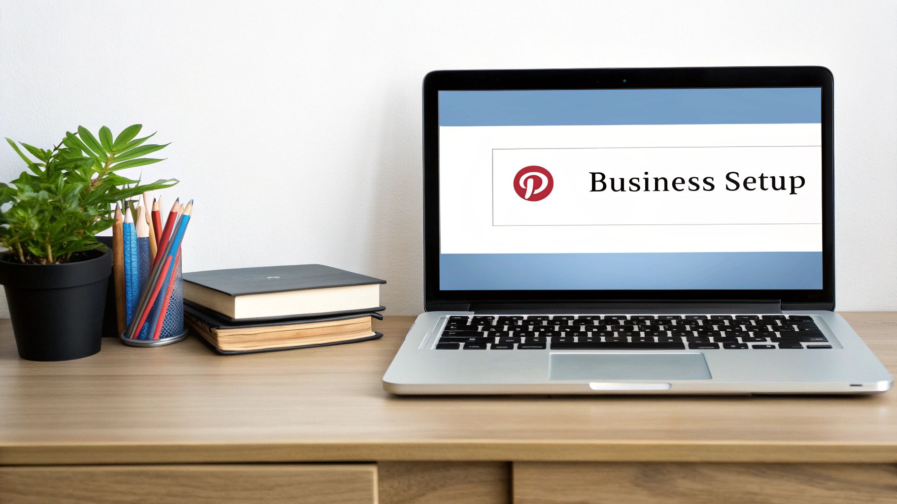 Laptop screen showing Pinterest Business Setup for creating a high-impact Pinterest storefront.