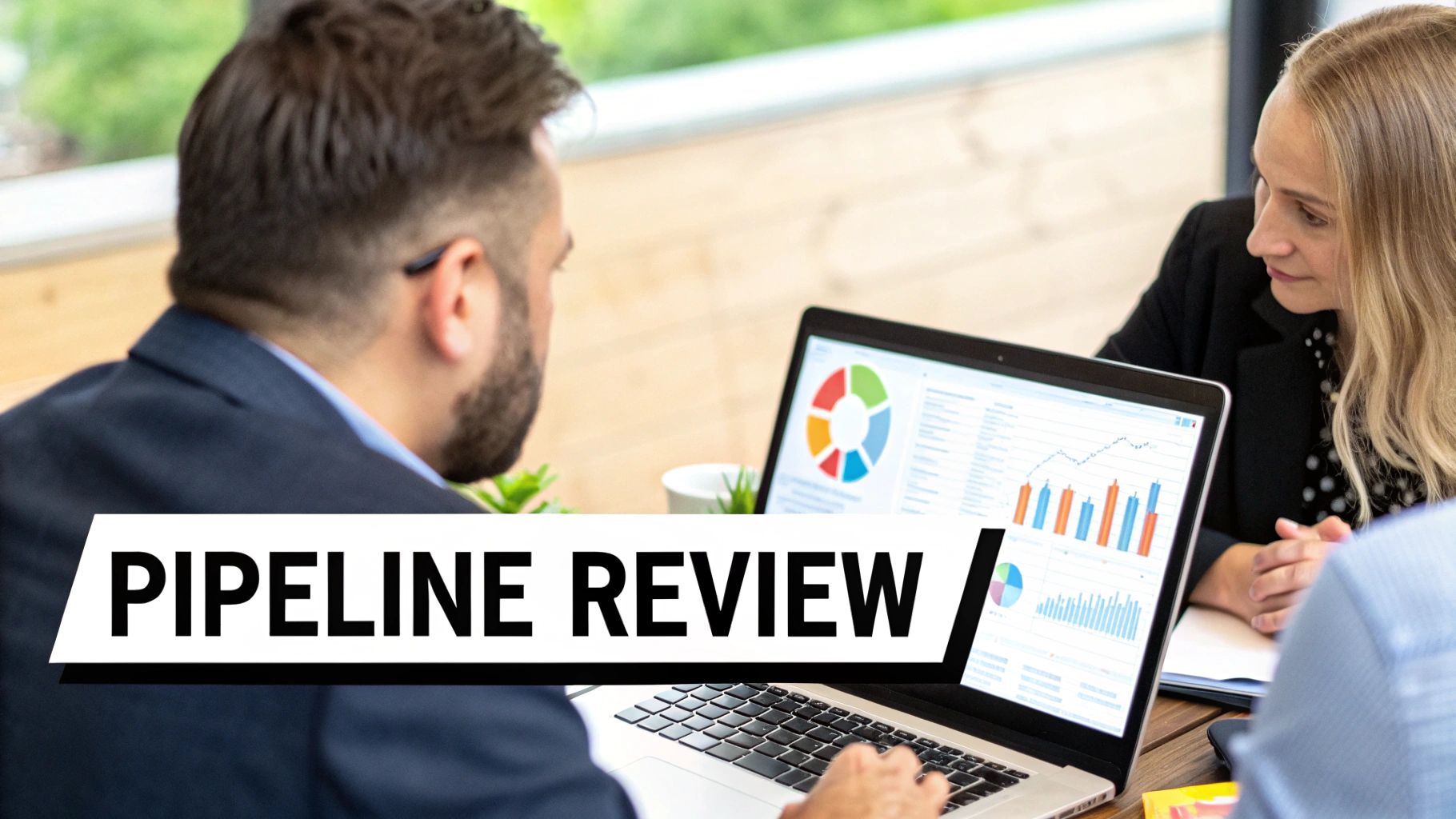 Sales manager reviewing pipeline data on a tablet with a team member, illustrating the concept of a regular review session.