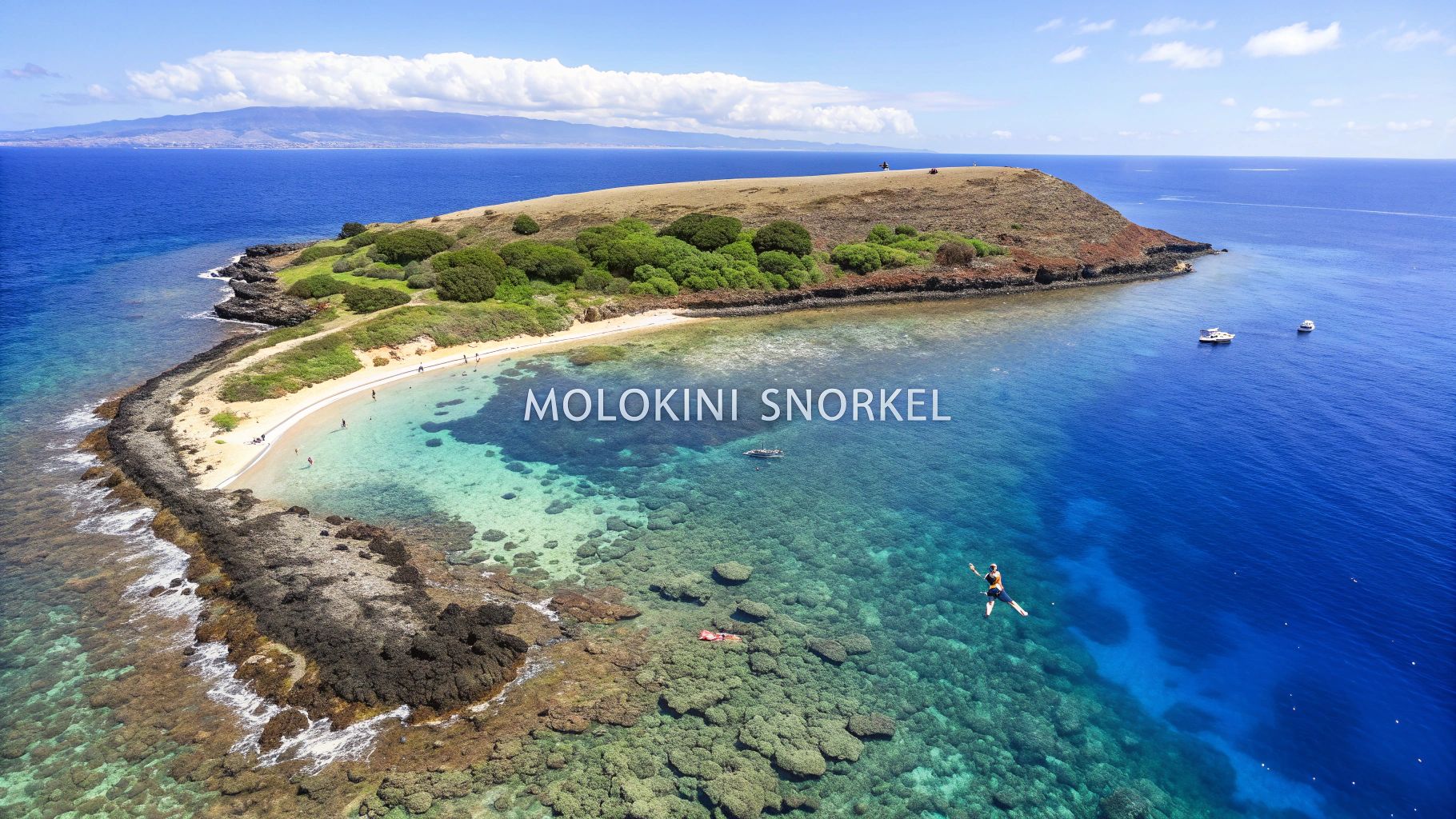 Aerial view of Molokini Crater, Hawaii, showing clear turquoise water, coral reefs, and people snorkeling.