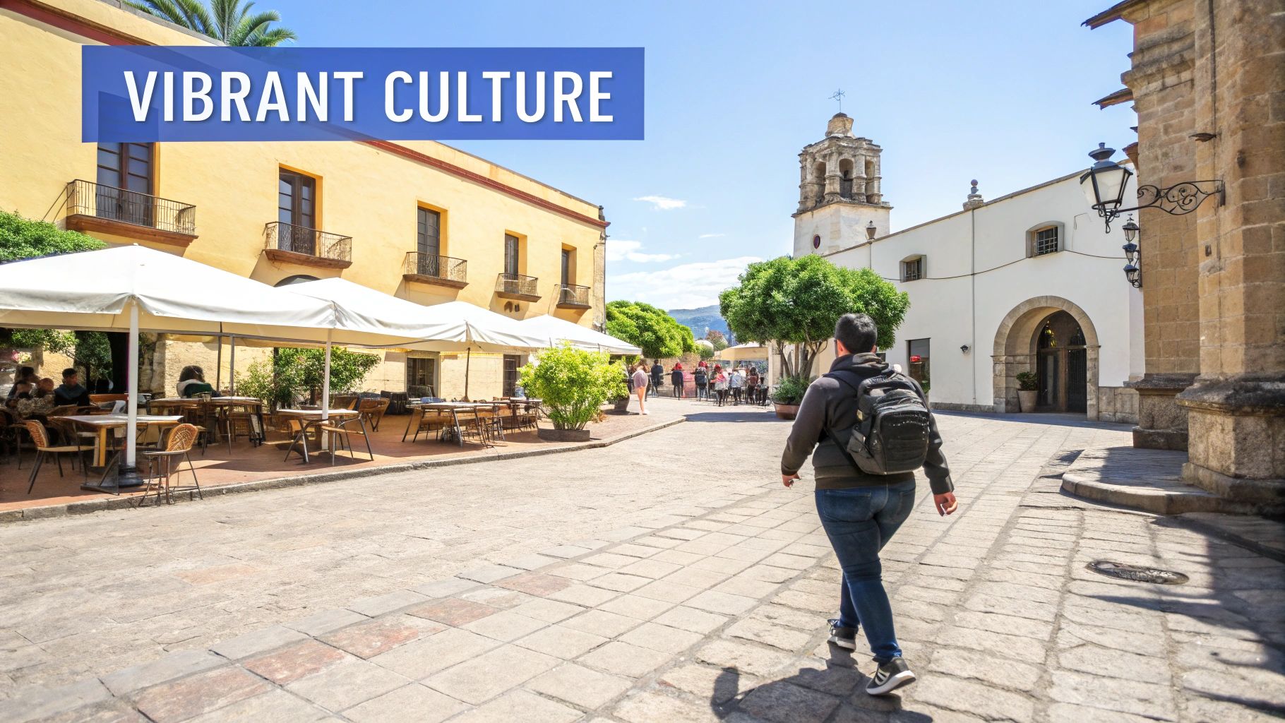 A person with a backpack walks through a vibrant, historic town square with cafes and a church.