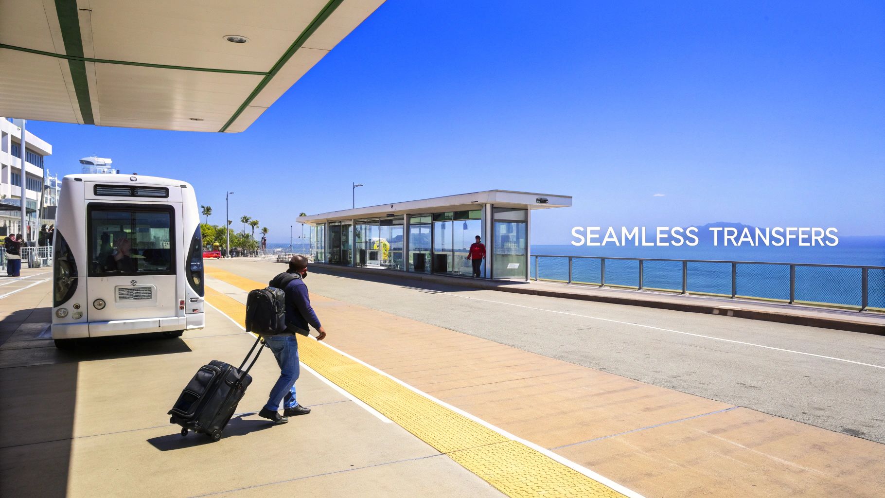 A traveler with luggage walks towards a bus and a modern glass bus stop by the ocean, emphasizing seamless transfers.