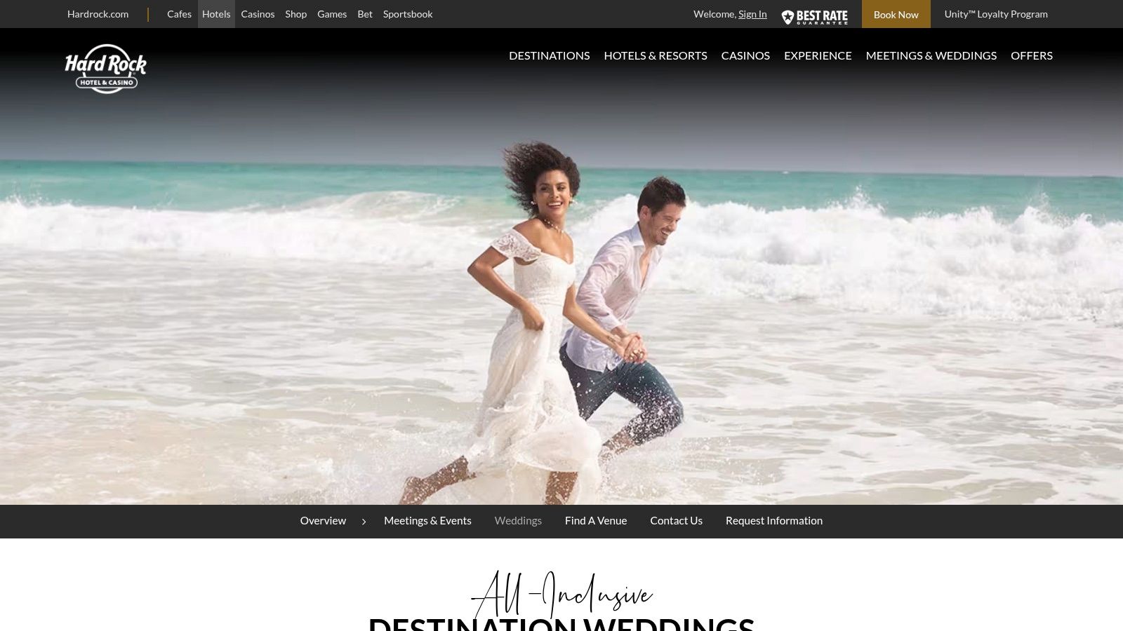 A beachfront wedding ceremony setup with white chairs and a floral arch at a Hard Rock All-Inclusive resort.