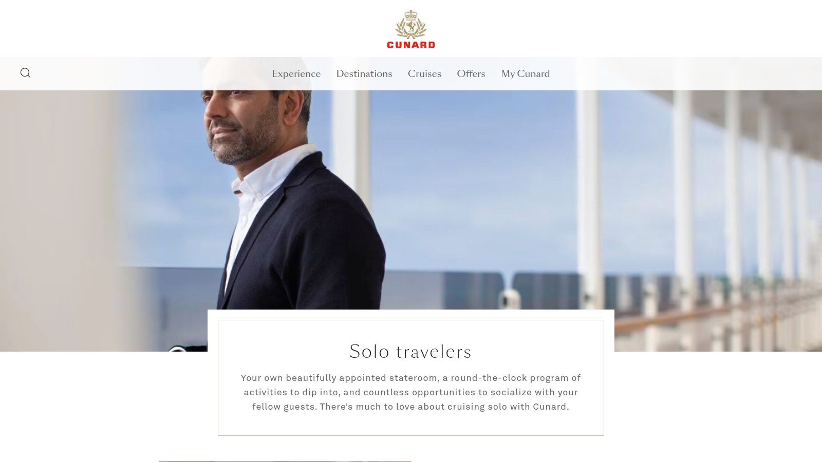 A stylishly appointed single stateroom on a Cunard ship, featuring a comfortable bed, classic decor, and an oceanview window.