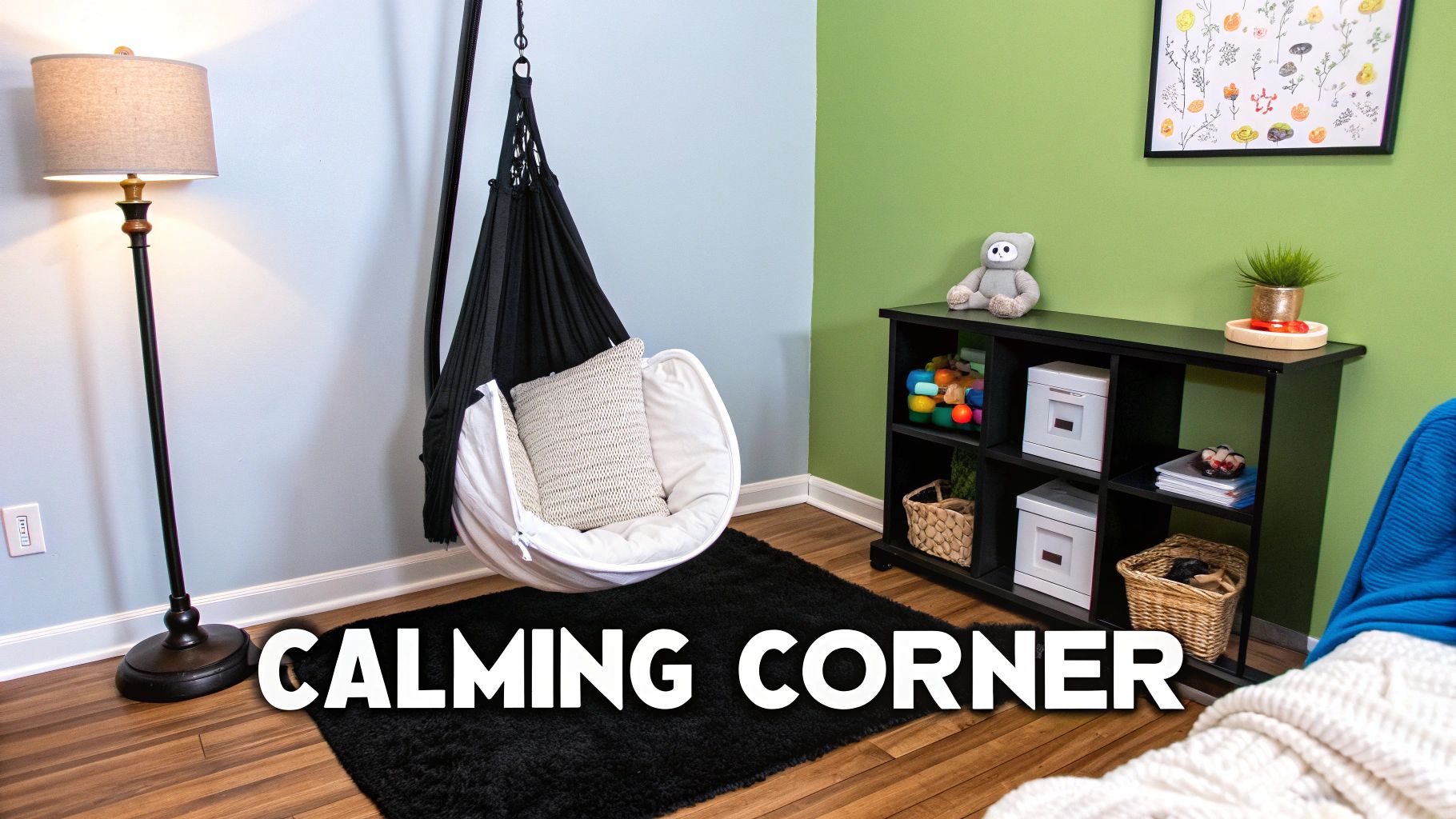 A cozy calming corner featuring a black sensory swing, a floor lamp, a shelving unit, and a soft rug.