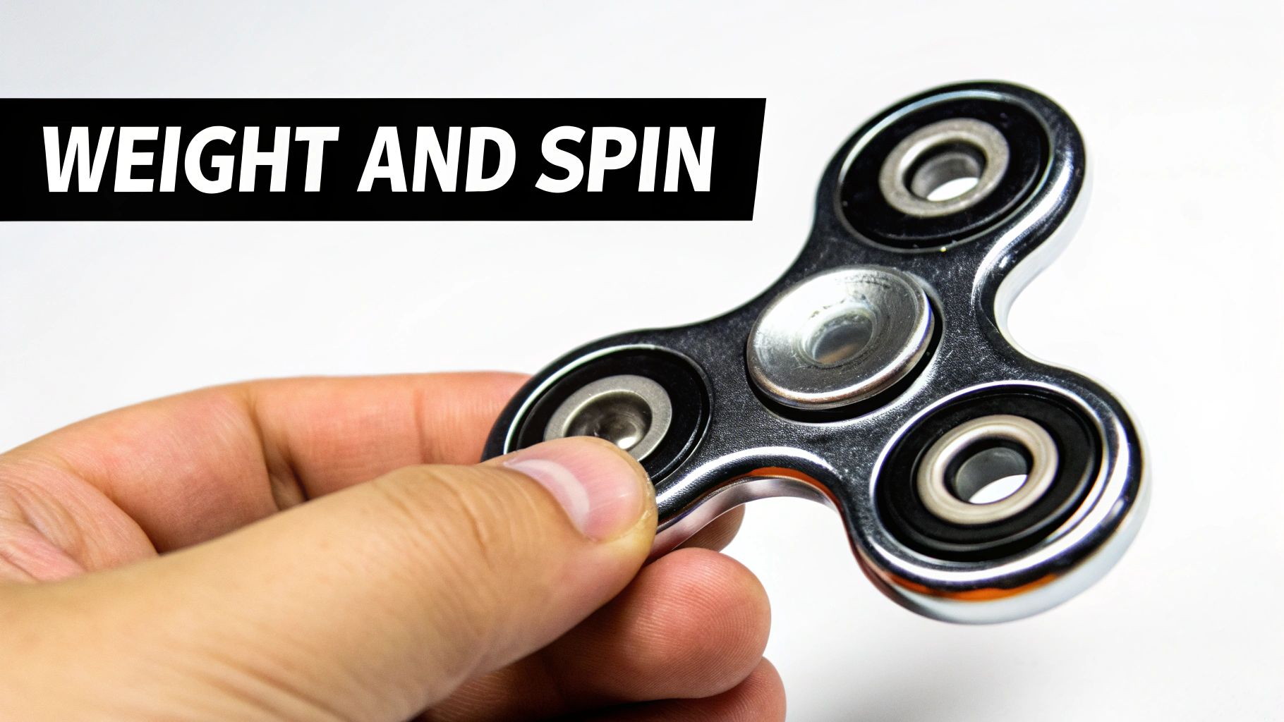 A hand holds a metallic fidget spinner with three arms, featuring the text "WEIGHT AND SPIN".