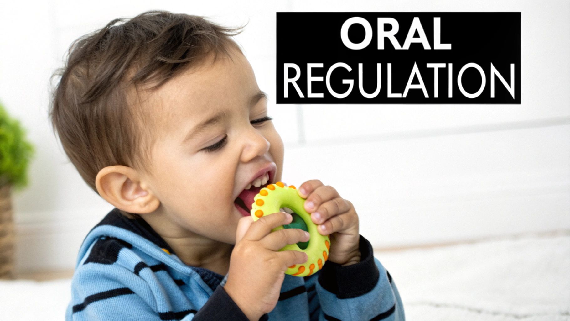 Smiling child with closed eyes chews on a bright green sensory teether toy.