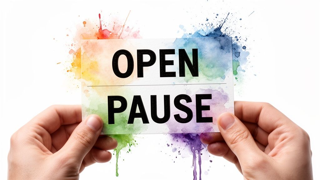 Hands holding a card with 'OPEN PAUSE' in black text, surrounded by vibrant watercolor splashes.