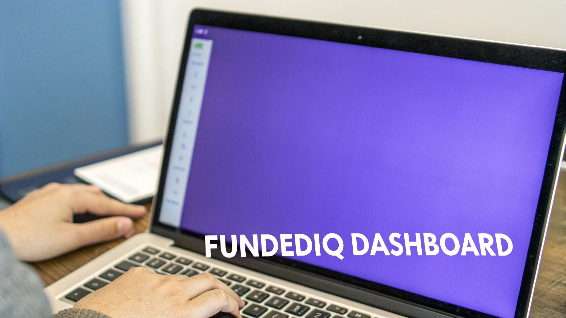 A person interacting with the FundedIQ dashboard on a laptop, showing graphs and data points related to intent data.